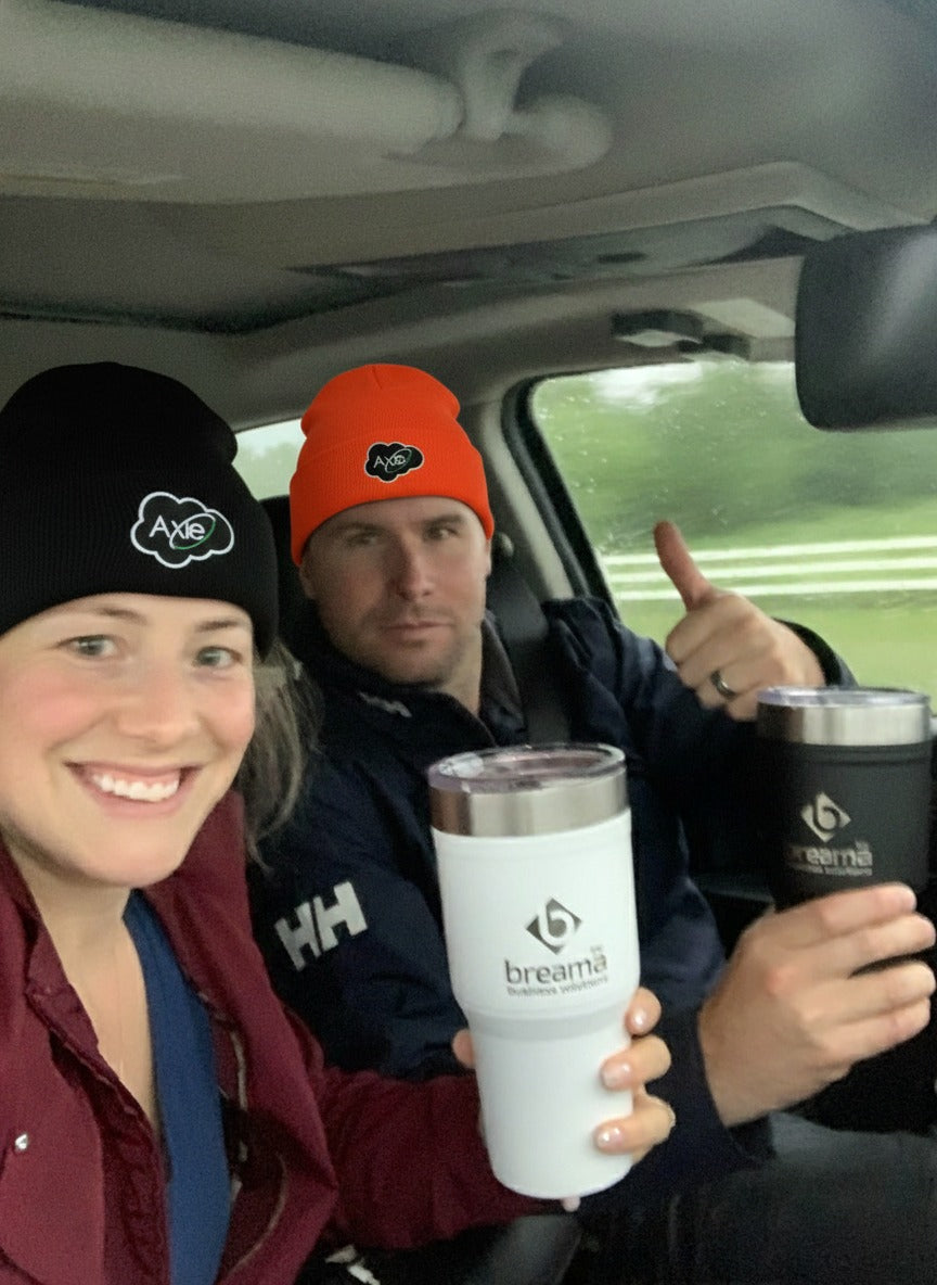 Axle black and orange beanies worn in the field